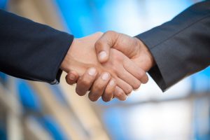 Business Men And Women Shaking Hands