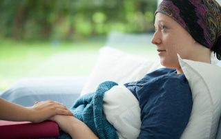 cancer woman lying in bed